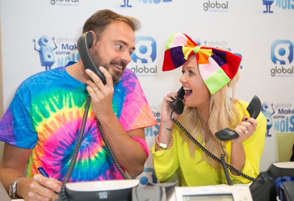 Jamie Theakston and Emma Bunton answer the phones during Global's Make Some Noise Charity Day at Global Radio station in Leicester Square, London.