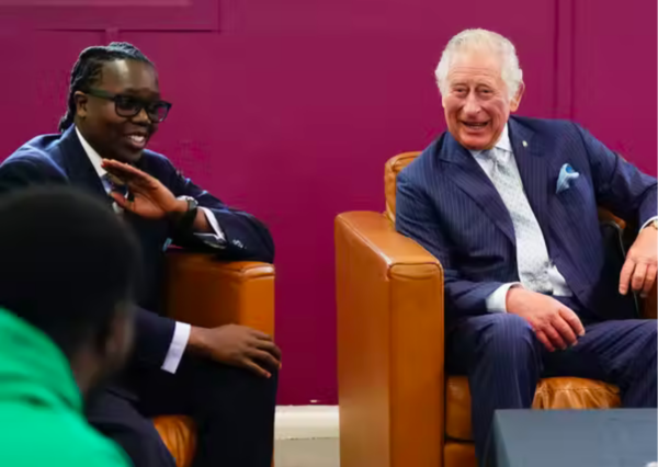 Prince Charles listening to the Founder of the BIGKID foundation